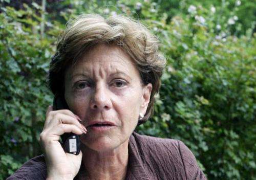 File picture of Neelie Kroes talking on a mobile phone in Wassenaarseslag, Netherlands, on August 3, 2004