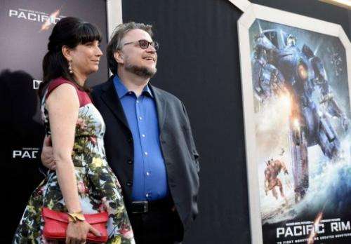 Filmmaker Guillermo del Toro (R) and his spouse Lorenza Newton, pictured in Hollywood, on July 9, 2013