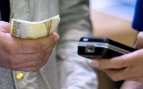 Financial groups are battling to control the lucrative future of 'mobile money', which lets people pay via a smartphone