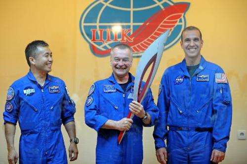 From L-R: The International Space Station Expedition 38 crew Japanese astronaut Koichi Wakata, Russian cosmonaut Mikhail Tyurin 
