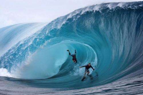 Garrett McNamara (left) and Mark Healey, both of the US, compete in a surfing event at Teahupoo, Tahiti, on June 1, 2013