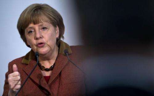 German Chancellor Angela Merkel addresses guests during a function in Berlin on February 20, 2013