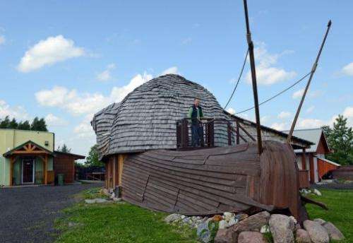 Grzegorz Skalmowski outside his office as his snail farm in Krasin, northern Poland, on May 29, 2013