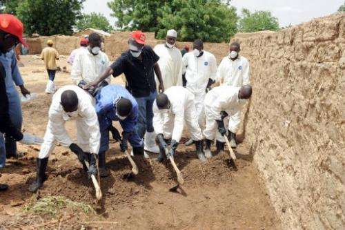 Health workers excavate contaminated soil at Dareta village, Anka district in Zamfara State on June 10, 2010