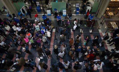 Holiday travelers line up for one of the TSA security checkpoints at Ronald Reagan National Airport in Washington on November 26