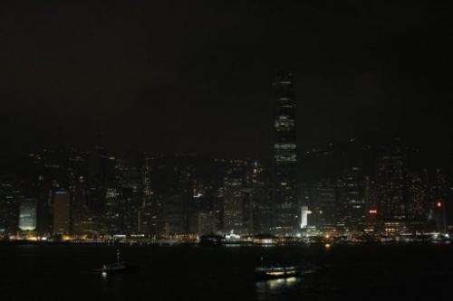 Hong Kong's Victoria Harbour waterfront is seen with its lights dimmed during Earth Hour on March 31, 2012