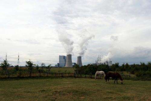 Horses graze in front of the new Neurath lignit coal-fired RWE power station on September 11, 2012 at Grevenbroich