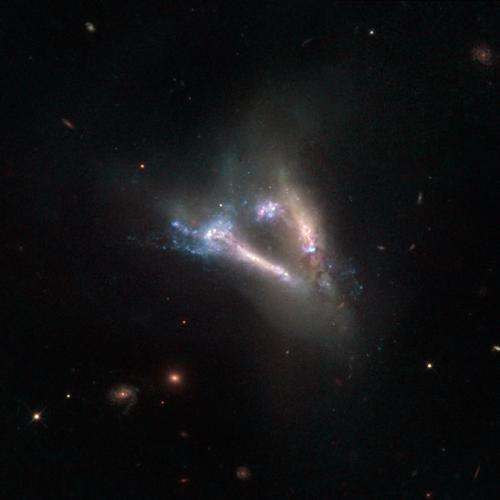Hubble Sees Cosmic “Flying V” of Merging Galaxies