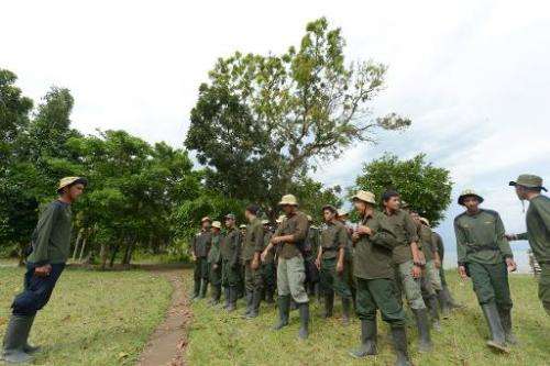 Indonesian rangers from the Rhino Monitoring Unit prepare for a 10-day monitoring trip at Ujung Kulon National Park in Banten pr