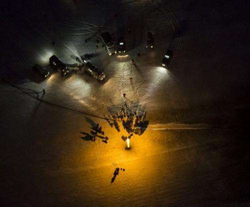 In this released NASA photo, a spacecraft is seen after it landed in a remote area in Kazakhstan on November 19, 2012
