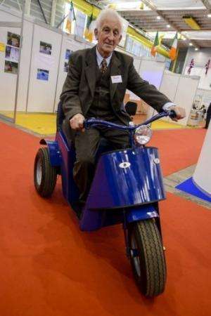 James Dower sits astride the &quot;Tilt and Turn&quot; at the International Exhibition of Inventions in Geneva on April 10, 2013