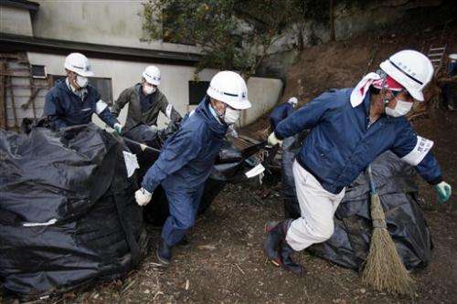 Japan's cleanup lags from tsunami, nuke accident