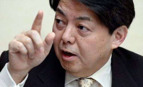 Japan's fisheries minister Yoshimasa Hayashi answers questions during an interview in Tokyo on February 26, 2013