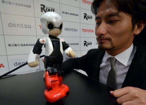 Japan's Tokyo University robot creator Tomotaka Takahashi demonstrates robot Kirobo in Tokyo on June 26, 2013
