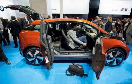 Journalists view BMW's i3 electric car at the Frankfurt Motor Show (IAA) on September 9, 2013
