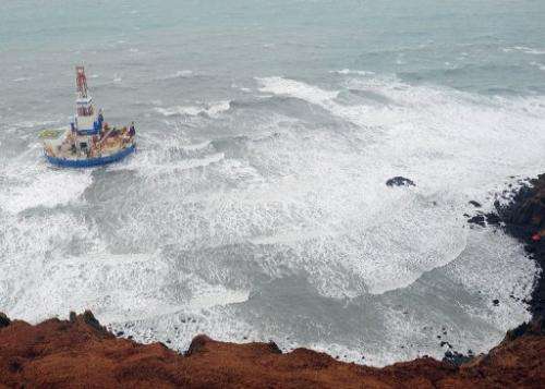 Kulluk drilling unit aground on the southeast shore of Sitkalidak Island, Alaska, January 1, 2013