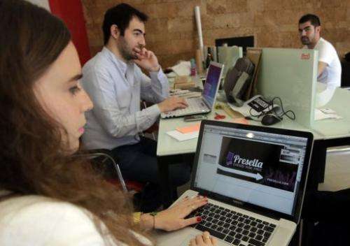 Lebanese entrepreneurs from different internet start-up companies work in Beirut on April 24, 2013