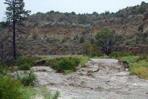 Los Alamos National Laboratory describes storm damage to environmental monitoring stations, canyons