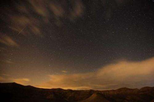 Meteor streaks are seen above the desert near the Israeli Kibbutz of Ein Gedi, early on December 14, 2012