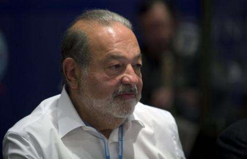 Mexican tycoon Carlos Slim attends a meeting in Mexico City on March 17, 2013