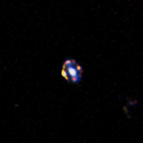 Most distant gravitational lens helps weigh galaxies