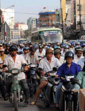 Motorbikes steam through Ho Chi Minh City in Vietnam on February 25, 2009