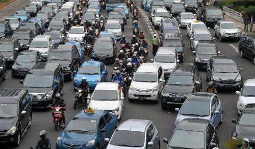Motorists are trapped in the rush-hour gridlock in Jakarta, on October 21, 2013