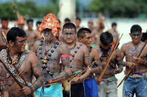 Munduruku people rally in front of the Planalto Palace in Brasilia, on June 6, 2013 to call for more say in the Belo Monte dam p
