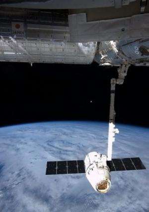 NASA image captured by astronaut Chris Hadfield on board the ISS on March 27, 2013 shows the Dragon capsule.