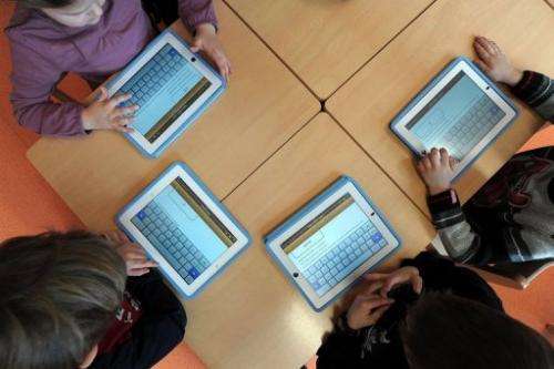 Nursery school pupils work with tablet computers on March 18, 2013 in Haguenau, northeastern France