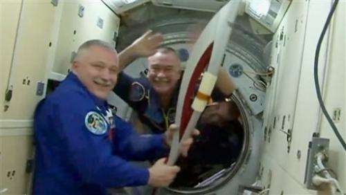 Olympic torch blasts into space for 1st spacewalk