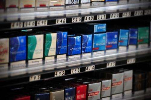 Packets of cigarettes are pictured in a shop in central London on July 12, 2013