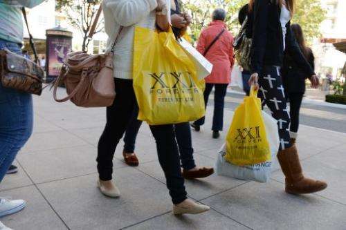 People look for sales the old-fashioned way—at a shopping mall—in Glendale, California, on December 26, 2012