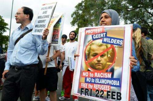 People protest outside the venue where right-wing Dutch MP Geert Wilders was speaking in Sydney, February 22, 2013