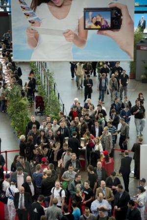 People queue at the south entrance for the IFA trade fair in Berlin on August 31, 2012