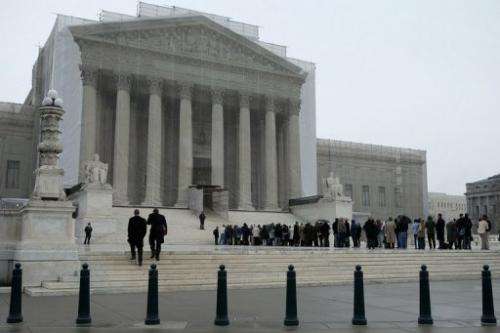 People stand outside U.S. Supreme Court on March 18, 2013 in Washington, DC