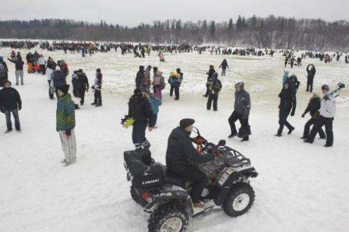 People take part in a fishing event on the frozen lake Viljandi in Viljandi, Estonia on February 16, 2013