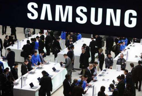 People visit a Samsung stand in Barcelona on February 26, 2013