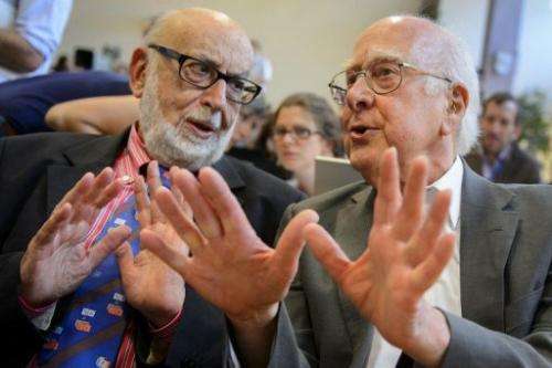 Peter Higgs (R) speaks with Francois Englert on July 4, 2012 at CERN offices in Meyrin near Geneva