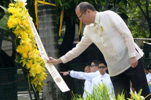 Philippine President Benigno Aquino lays a wreath in Manila on June 12, 2013