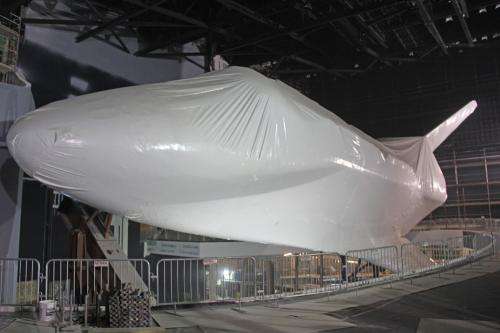 Plastic wrapped Shuttle Atlantis slated for grand public unveiling in June