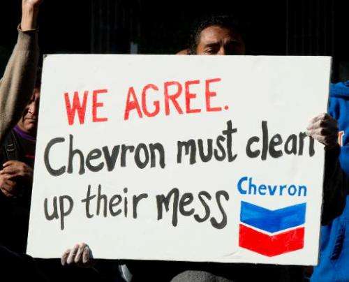 Protesters gather in the Federal Plaza in Manhatan to protest against Chevron Corporation October 15, 2013 in New York