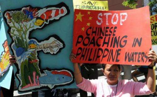 Protesters rally in front of the Chinese consular office in Manila on April 11, 2013