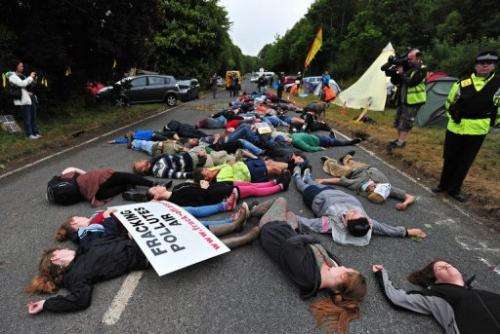 Protestors lie on the road to a drill site operated by Cuadrilla Resources in Balcombe, England, on July 31, 2013