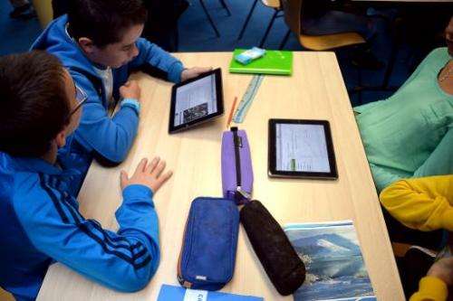 Pupils use tablets during courses in a classroom at the Leonard de Vinci 'connected' middle school in Saint-Brieuc, western Fran