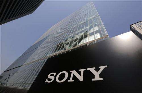 Red ink runs at Sony again, cuts profit forecast