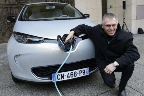 Renault chief operating officer Carlos Tavares with a Zoe electric car in Paris on December 17, 2012