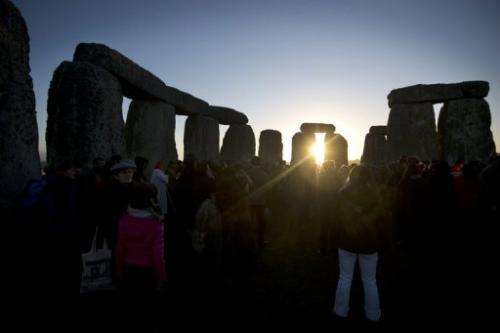 Revellers celebrate the pagan festival of 'Winter Solstice' at Stonehenge in Wiltshire, England on December 21, 2012