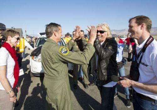 Richard Branson and pilot Mark Stucky celebrate the successful flight of SpaceShipTwo on April 29, 2013