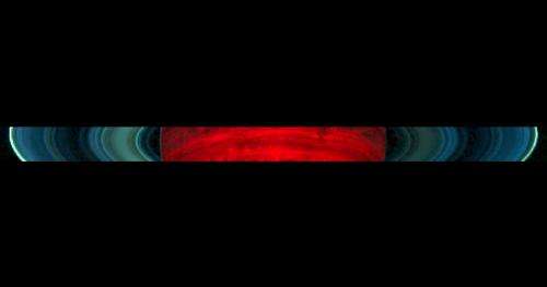 Rings, dark side of Saturn glow in new Cassini image